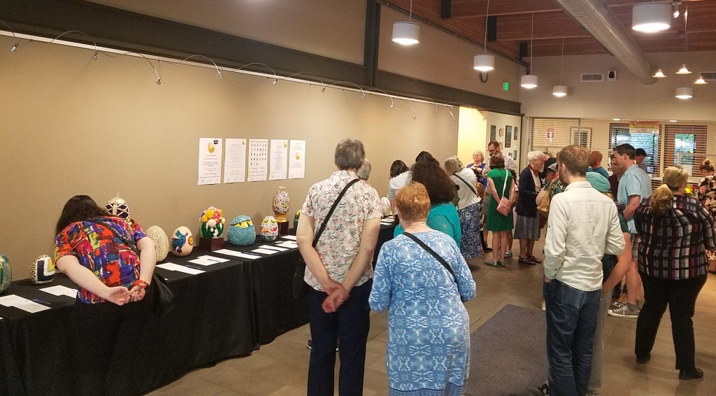 Lynnwood Times photo by  Luke Putvin. Attendees at the Eggs-plore auction on June 13.