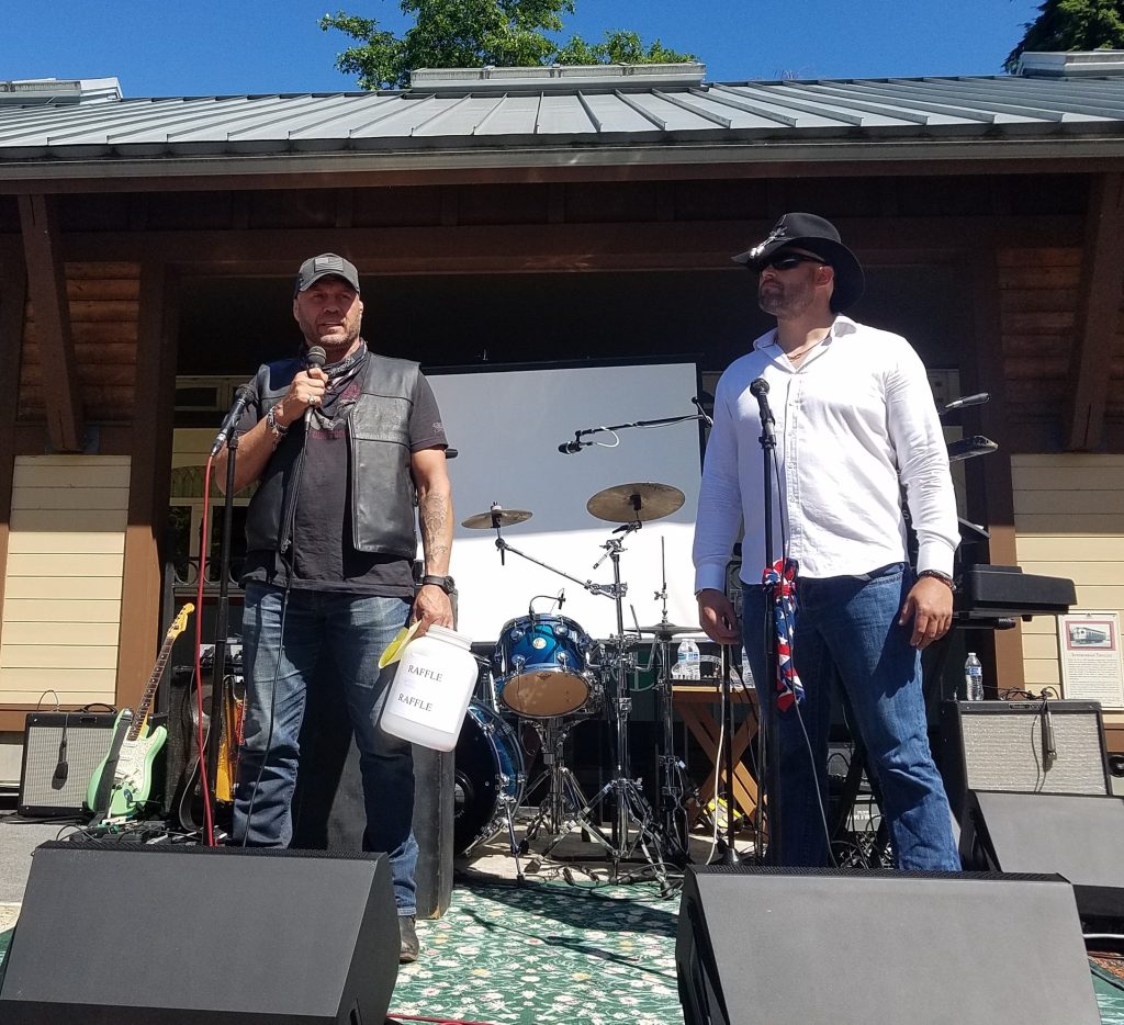 Lynnwood Times photo by Mario Lotmore. Randy Couture (left) and former combat veteran U.S. Army Platoon Sergeant and Apache pilot Joseph Wankelman (right) at the Xtreme Couture Poker Run on June 15.