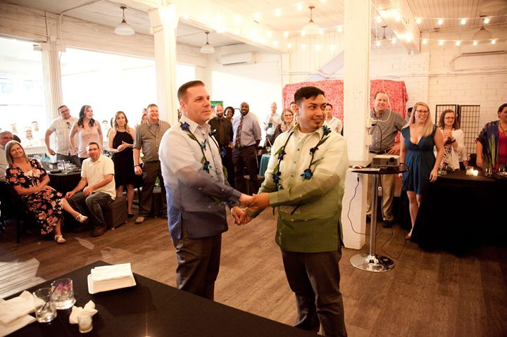 Photo of Shawn Chapman (left) and Richard cross (right) at their Post Marriage Equality Wedding Reception in Seattle in 2016 (Photo credit: Luis Ongpin).