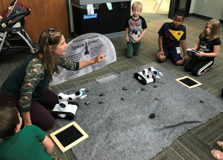 Lynnwood Times Photo by Luke Putvin. Heidi Larsen (left) and children at Space Quest on July 15 at Lynnwood Library.