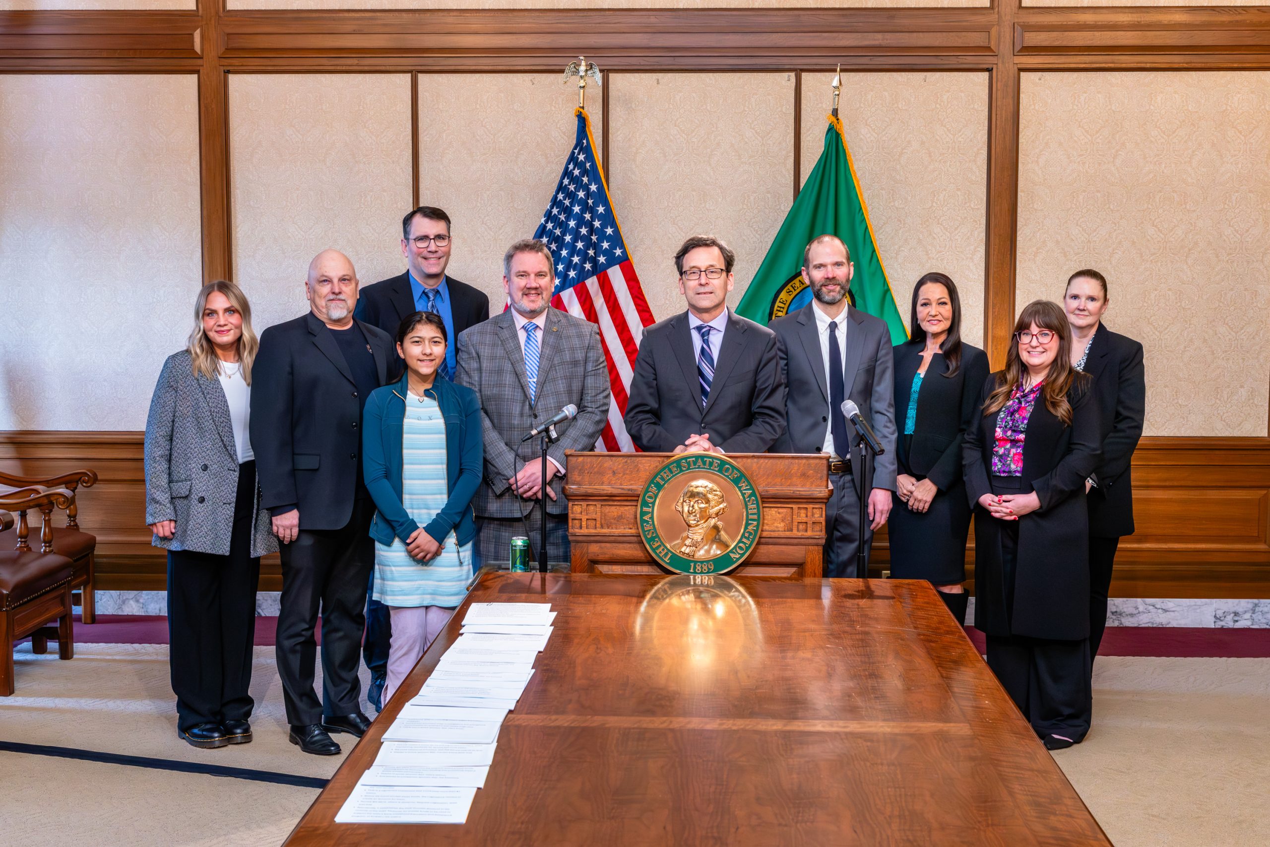 Gov. signs Low bill protecting families of fallen first responders from health coverage gaps